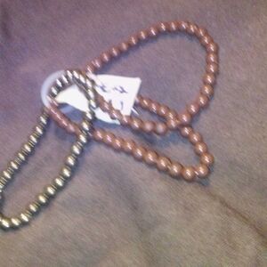 2 brown bracelets ,1 gold. Lot of 3